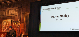 Author Walter Mosley addresses the BISG Annual meeting from the podium on the stage in New York City's Harvard Club